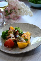 Colorful grilled chicken skewer with vibrant vegetables as a delicious food background. 