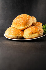 Bun burger puffy soft buns baking fresh delicious gourmet food background on the table rustic food top view copy space