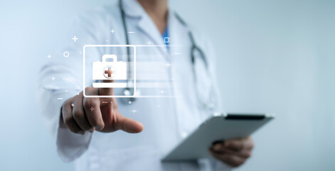Fototapeta premium Doctor tapping digital medical bag icon with futuristic interface technology. Healthcare access, smart hospital system, online medical service and AI-assisted treatment concept