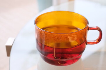 cup of hot tea on the outdoor table
