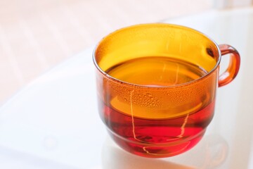 cup of hot tea on the outdoor table

