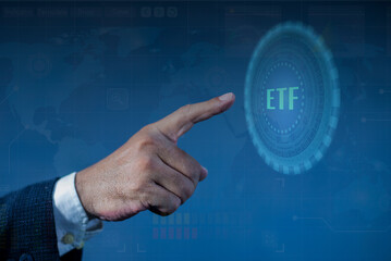 Businessman pointing at ETF (Exchange Traded Funds). Investment Opportunities in Mutual Funds and ETFs, Growing Wealth in the Financial Market. investment financial concept. ETF