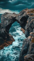 Dramatic archway rock formation over crashing waves