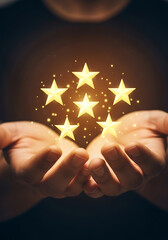 Person holding glowing golden stars representing achievement and customer satisfaction