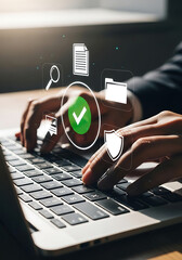 Person working on laptop with digital icons representing document security and verification