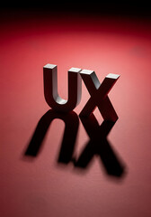 Silver UX Letters Red Background Shadow user experience