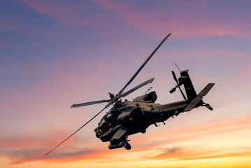 Fototapeta premium Combat Helicopter at Sunset, Close-up of a combat helicopter in flight during sunset, highlighting its powerful design and mission readiness.