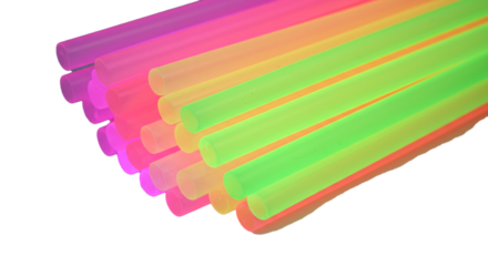 A close up view of a stack of colorful plastic drinking straws on a black background surface on transparent background