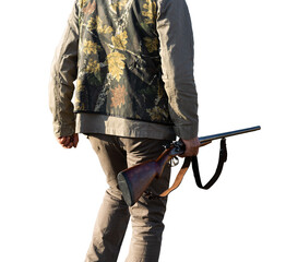 Mature man hunter with gun while walking on field with your dogs
