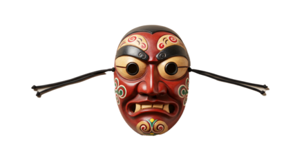 Close up of a traditional korean mask with red face and decorative details on a black background on transparent background