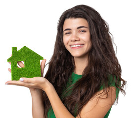 Happy house buyer. A young girl holds a model of a green house in her hands. The concept of green...