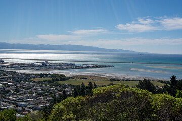 Scenic Coastal View with Harbor and Mountains