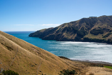 Scenic Coastal Landscape with Rolling Hills and Blue Sea