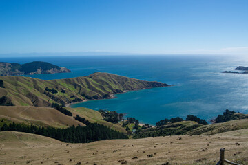 Panoramic Coastal Landscape with Rolling Hills and Blue Sea