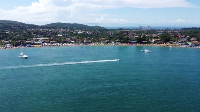 Boat Racing Across Ferradura Beach, B&uacute;zios, Brazil: A 2.7K Drone View of Tropical Seaside Fun and Ocean Adventure