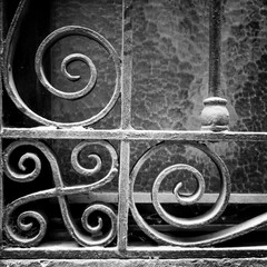 Ornate metal security grill in front of a window, Barcelona