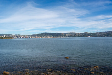 Serene Bay View with City Skyline and Hills