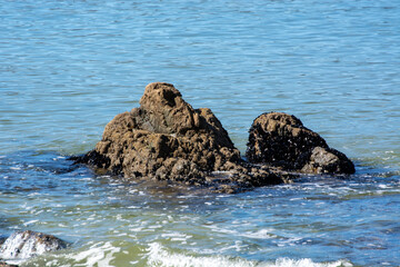 Serene Rocky Formation in Calm Waters