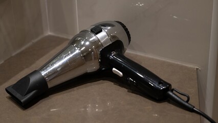 Modern Hair Dryer on Bathroom Counter