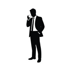 Fototapeta premium Silhouette of a businessman in a suit smoking a cigarette