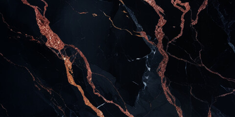 Luxurious marble texture with a predominantly black background and flowing patterns with golden veins running through it, creating a striking contrast.