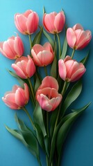 Obraz premium A Stunning Bouquet of Pink Tulips on a Vibrant Blue Background