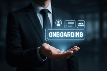 Onboarding concept: A professional displays the word onboarding hovering above his hand, suggesting the idea of welcoming new employees, in a technological, modern business setting.