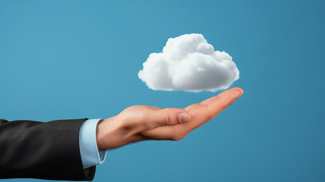 The hand of a businessperson in a suit holding a fluffy white cloud, perfect for illustrating corporate cloud computing services or data solutions