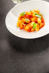 Gnocchi tomato sauce fresh delicious gourmet food background on the table  rustic food top view copy space