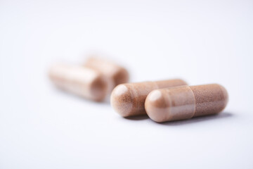 Ashwagandha (Withania somnifera) capsules. Concept for a healthy dietary supplementation. Bright...