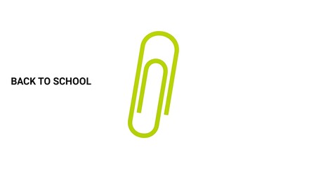 Obraz premium A green paperclip on a white background with the words back to school on the left side