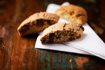 Cantuccini (Italian cookies) on dark wooden background. Close up	