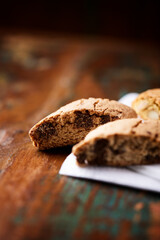 Cantuccini (Italian cookies) on dark wooden background. Close up	