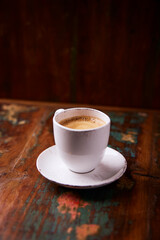 Cup of coffee on wooden background. Soft focus. Copy space	