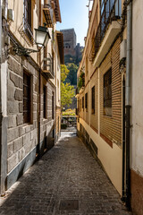 Streets and old buildings of Granada in Andalusia (Spain). El Albaicin (or Albayzin). View of the streets and old buildings of Granada historic city of Andalusia (Spain).