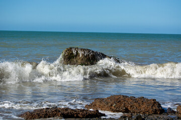 Serene Coastal Scene with Waves and Rocks