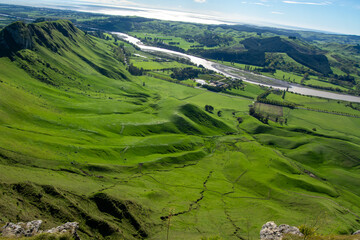 Lush Green Hills and Winding River Landscape