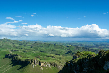 Lush Green Hills Under a Bright Blue Sky