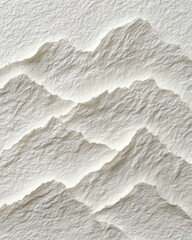 Obraz premium A close-up view of layered, sculpted paper mountains. The paper's texture is visible, with light and shadow highlighting the peaks and valleys. A subtle, almost ethereal quality is present