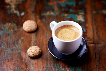 Cup of coffee on wooden background. Soft focus. Copy space	