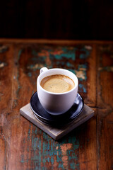 Cup of coffee on wooden background. Soft focus. Copy space	