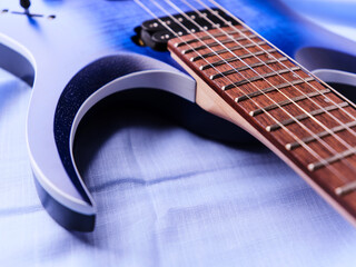 Fretboard of modern electric guitar. Close up.	