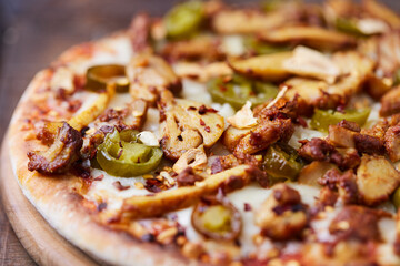 Gyros Pizza with jalapeno pepper and mozzarella cheese. Soft focus. Close up.	