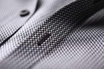 Close up of dark Men's shirt. Soft focus. Copy space.	