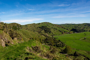 Fototapeta premium Lush Green Hills Under a Clear Blue Sky