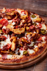 Gyros Pizza with jalapeno pepper, cherry tomatoes and mozzarella cheese. Soft focus. Close up.	