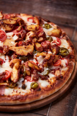 Gyros Pizza with jalapeno pepper, cherry tomatoes and mozzarella cheese. Soft focus. Close up.	