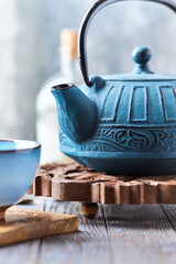 Japanese Cast Iron Teapot on bright background.	