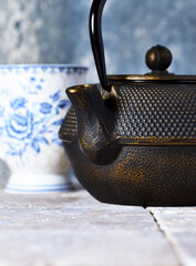 Japanese Cast Iron Teapot on bright background.	