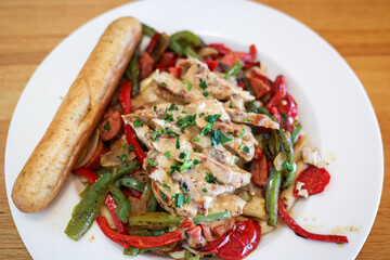 Chicken And Bell Peppers Over Pasta